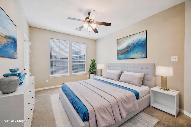 bedroom with baseboards, light colored carpet, and ceiling fan