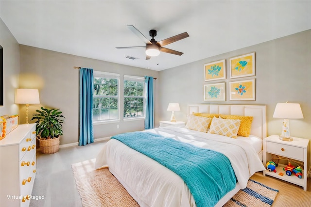 bedroom with baseboards, a ceiling fan, carpet flooring, and visible vents