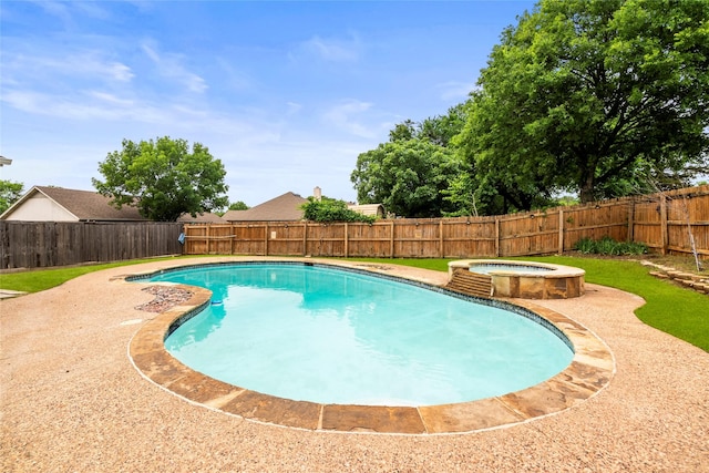 view of pool featuring a fenced backyard and a pool with connected hot tub