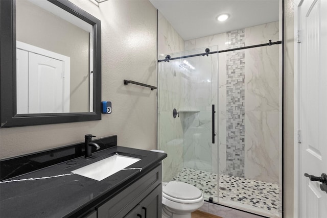408 Bethlehem St, Terrell, TX 75160 - full bathroom with a marble finish shower, toilet, vanity, and a textured wall