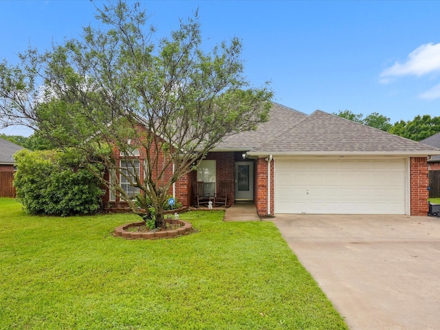 single story home featuring driveway, a front yard, a garage, brick siding, and a shingled roof
