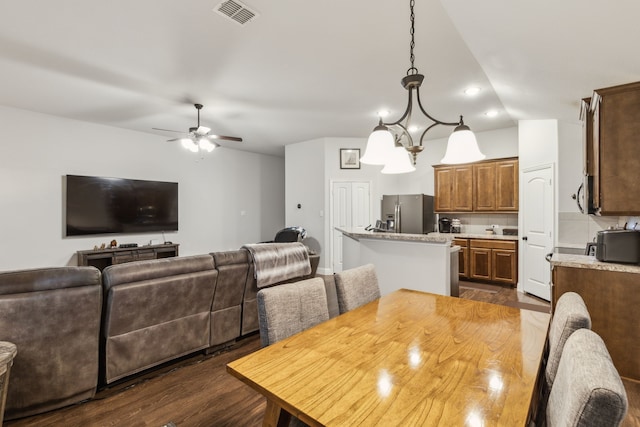 417 Highmeadow Dr, Aubrey, TX 76227 - dining room with dark wood-type flooring, ceiling fan, lofted ceiling, and visible vents