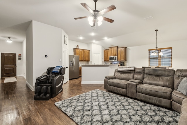 417 Highmeadow Dr, Aubrey, TX 76227 - living room with dark wood-type flooring, ceiling fan with notable chandelier, vaulted ceiling, and visible vents