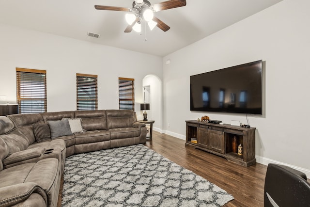 417 Highmeadow Dr, Aubrey, TX 76227 - living area with visible vents, baseboards, dark wood-type flooring, arched walkways, and a ceiling fan