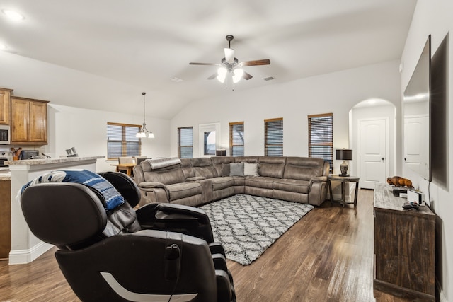 417 Highmeadow Dr, Aubrey, TX 76227 - living room featuring arched walkways, a ceiling fan, vaulted ceiling, visible vents, and dark wood-style floors