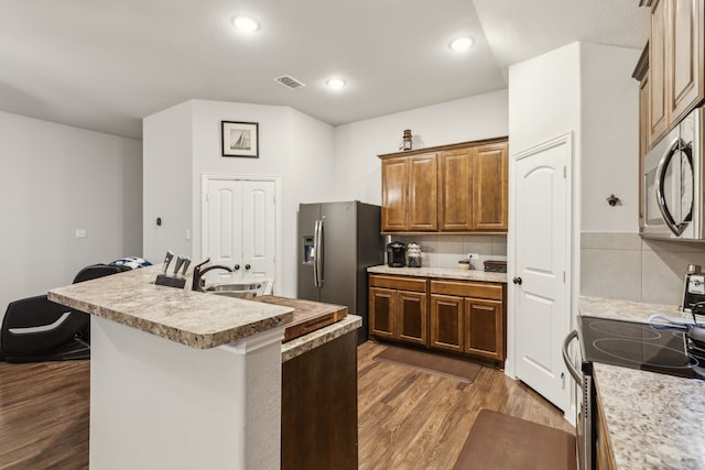 417 Highmeadow Dr, Aubrey, TX 76227 - kitchen with a sink, light countertops, stainless steel appliances, dark wood-type flooring, and visible vents