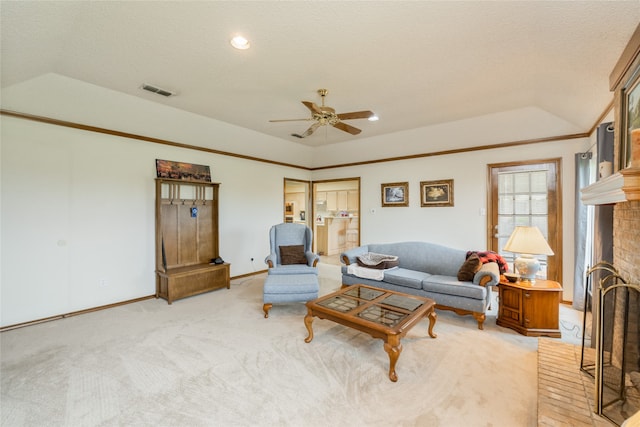 living area featuring ceiling fan, a brick fireplace, baseboards, lofted ceiling, and visible vents