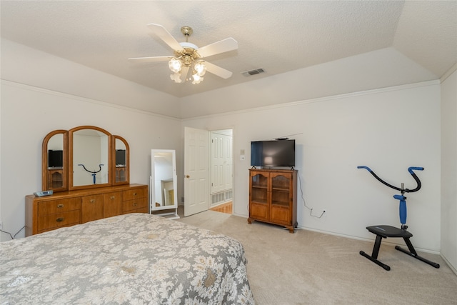 bedroom featuring a ceiling fan, a textured ceiling, visible vents, light colored carpet, and baseboards