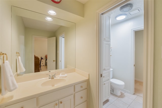 bathroom with vanity, recessed lighting, tile patterned floors, and toilet