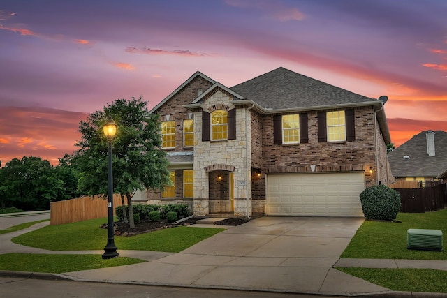 13029 Guerin Dr, Frisco, TX 75035 - view of front facade with fence, a yard, concrete driveway, and a garage