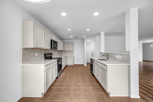 13029 Guerin Dr, Frisco, TX 75035 - kitchen featuring a sink, light countertops, tasteful backsplash, and stainless steel appliances