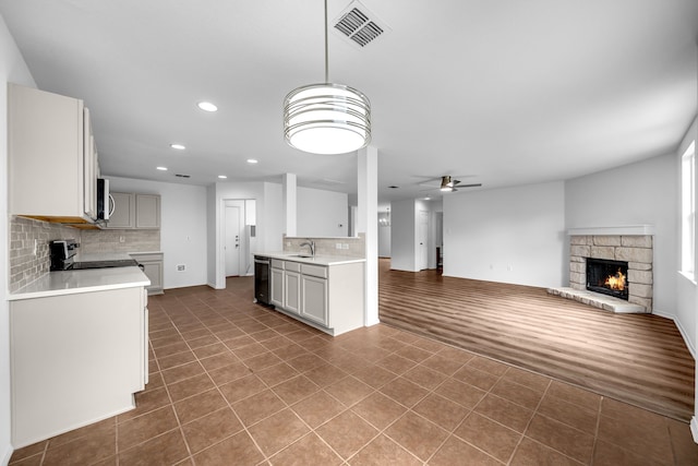 13029 Guerin Dr, Frisco, TX 75035 - kitchen with visible vents, a ceiling fan, dishwasher, a sink, and backsplash