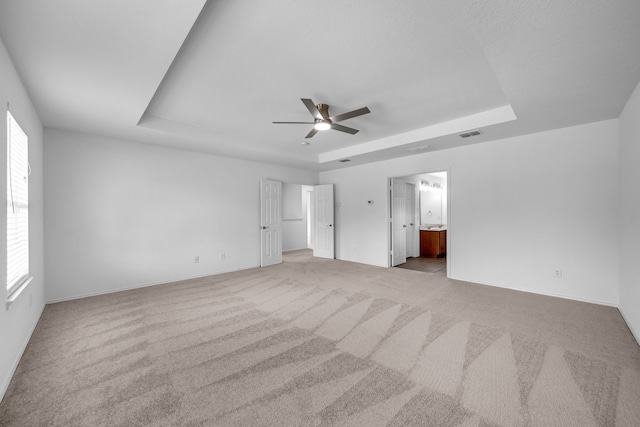 13029 Guerin Dr, Frisco, TX 75035 - unfurnished bedroom featuring carpet floors, baseboards, and a tray ceiling