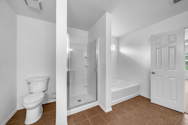13029 Guerin Dr, Frisco, TX 75035 - full bathroom with tile patterned flooring, toilet, visible vents, a bath, and a stall shower