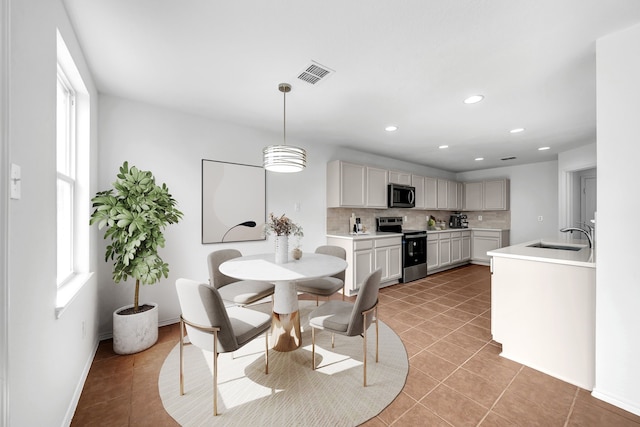 13029 Guerin Dr, Frisco, TX 75035 - dining space with baseboards, visible vents, plenty of natural light, and light tile patterned floors
