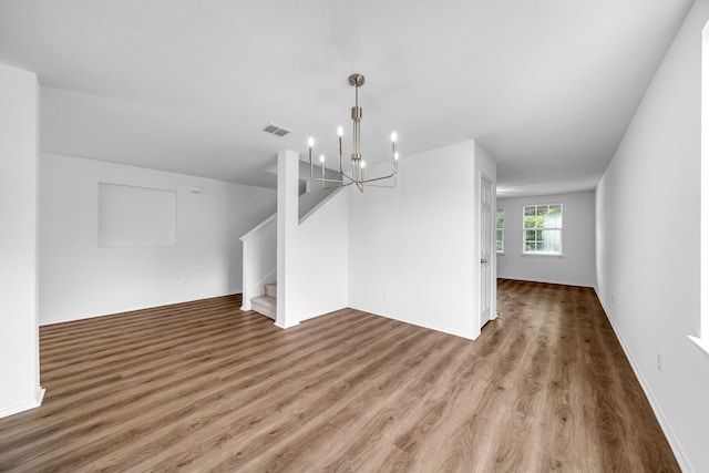 13029 Guerin Dr, Frisco, TX 75035 - interior space with visible vents, wood finished floors, baseboards, an inviting chandelier, and stairs