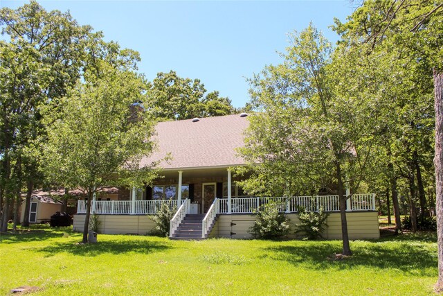 6928 Scott St, Eustace, TX 75124 - view of property hidden behind natural elements featuring a front lawn, a chimney, stairway, and roof with shingles