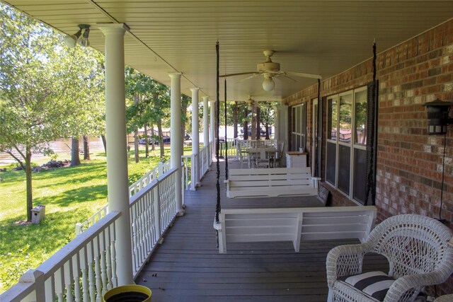 6928 Scott St, Eustace, TX 75124 - wooden deck with ceiling fan, a porch, and a yard