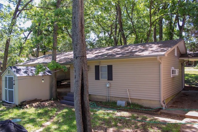 6928 Scott St, Eustace, TX 75124 - view of home's exterior featuring a storage shed, an outdoor structure, and a wall mounted AC