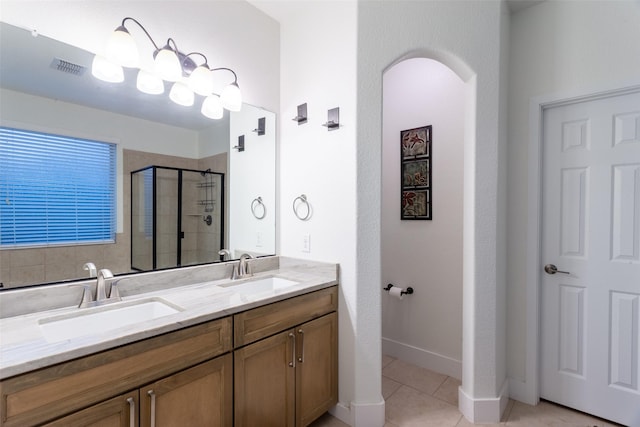 1309 Foxglove Ln, Burleson, TX 76028 - full bathroom featuring a stall shower, tile patterned floors, double vanity, and baseboards
