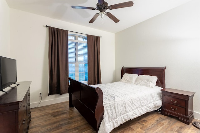 1309 Foxglove Ln, Burleson, TX 76028 - bedroom with dark wood-type flooring, baseboards, and ceiling fan
