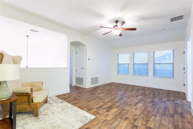 1309 Foxglove Ln, Burleson, TX 76028 - sitting room with wood finished floors, arched walkways, ceiling fan, and baseboards