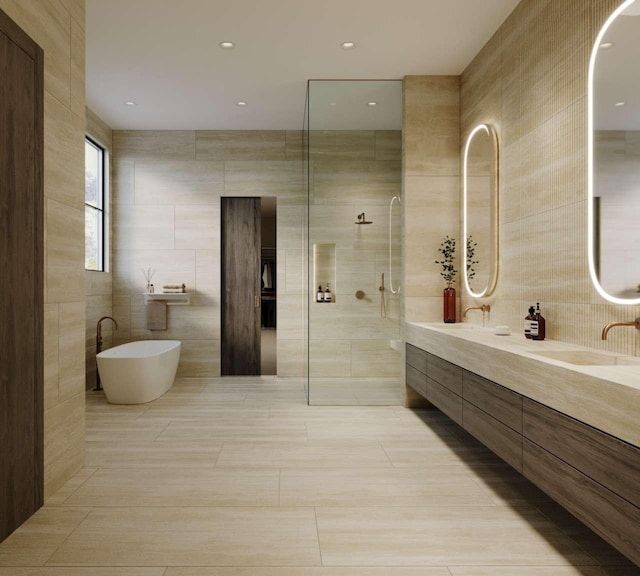 full bathroom with double vanity, a freestanding tub, tile walls, and tiled shower
