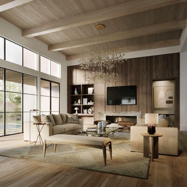 living room featuring beamed ceiling, a wealth of natural light, wood-type flooring, and a chandelier