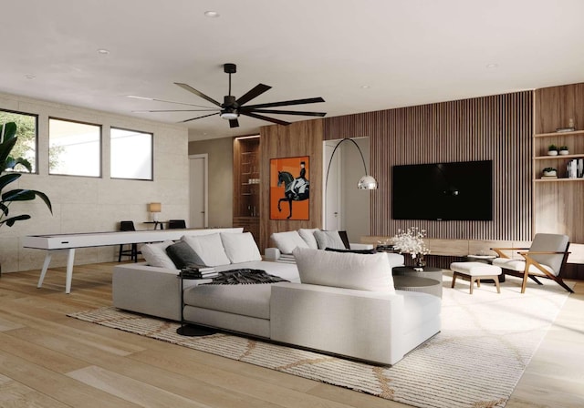 living area featuring a ceiling fan and wood finished floors