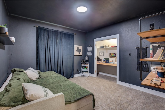 bedroom with carpet floors and baseboards