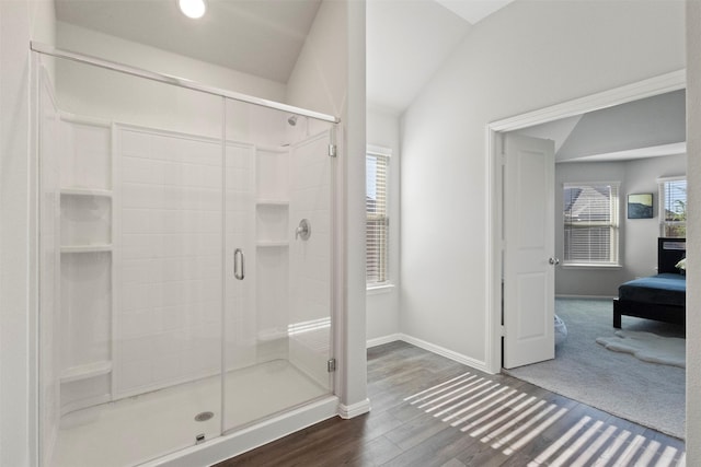 1421 Avalon Ct, Celina, TX 75009 - ensuite bathroom with a stall shower, baseboards, wood finished floors, and lofted ceiling
