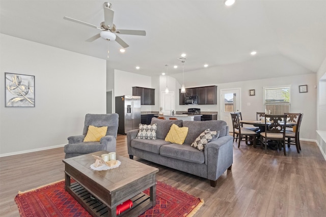 1421 Avalon Ct, Celina, TX 75009 - living area with light wood-type flooring, ceiling fan, baseboards, recessed lighting, and vaulted ceiling