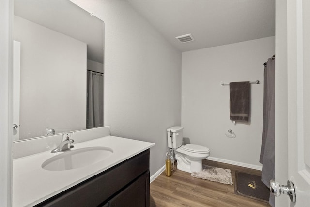 1421 Avalon Ct, Celina, TX 75009 - bathroom featuring vanity, toilet, wood finished floors, baseboards, and a shower with shower curtain