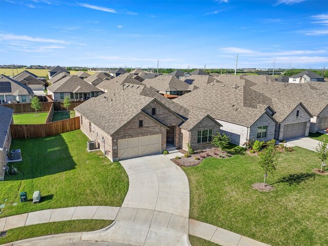 1421 Avalon Ct, Celina, TX 75009 - view of front of home featuring driveway, brick siding, and a garage