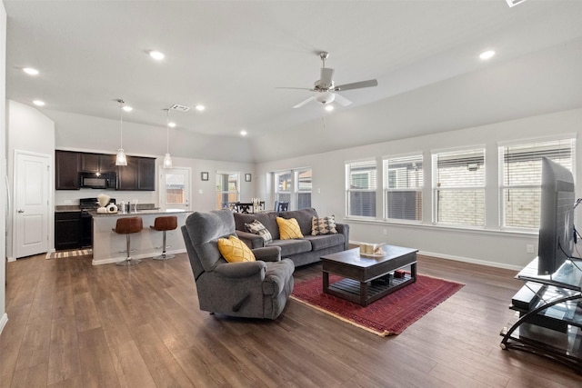 1421 Avalon Ct, Celina, TX 75009 - living area with dark wood-style floors, lofted ceiling, ceiling fan, recessed lighting, and baseboards
