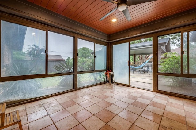unfurnished sunroom with recessed lighting and wooden ceiling