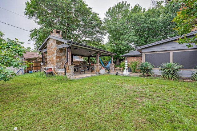 view of yard featuring fence and a patio area