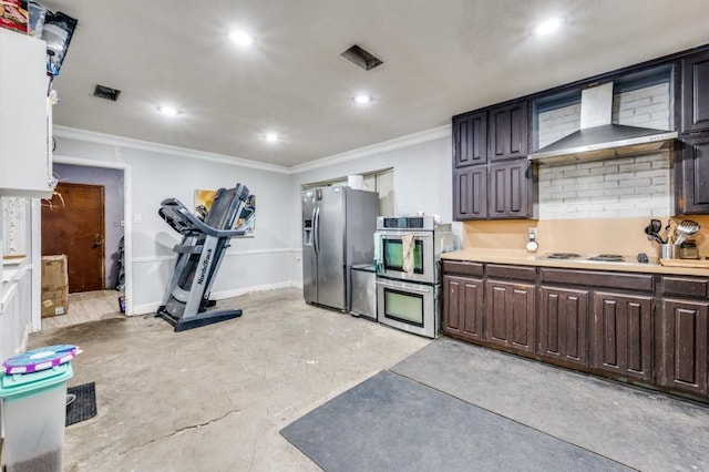 kitchen with dark brown cabinetry, light countertops, wall chimney exhaust hood, recessed lighting, and ornamental molding