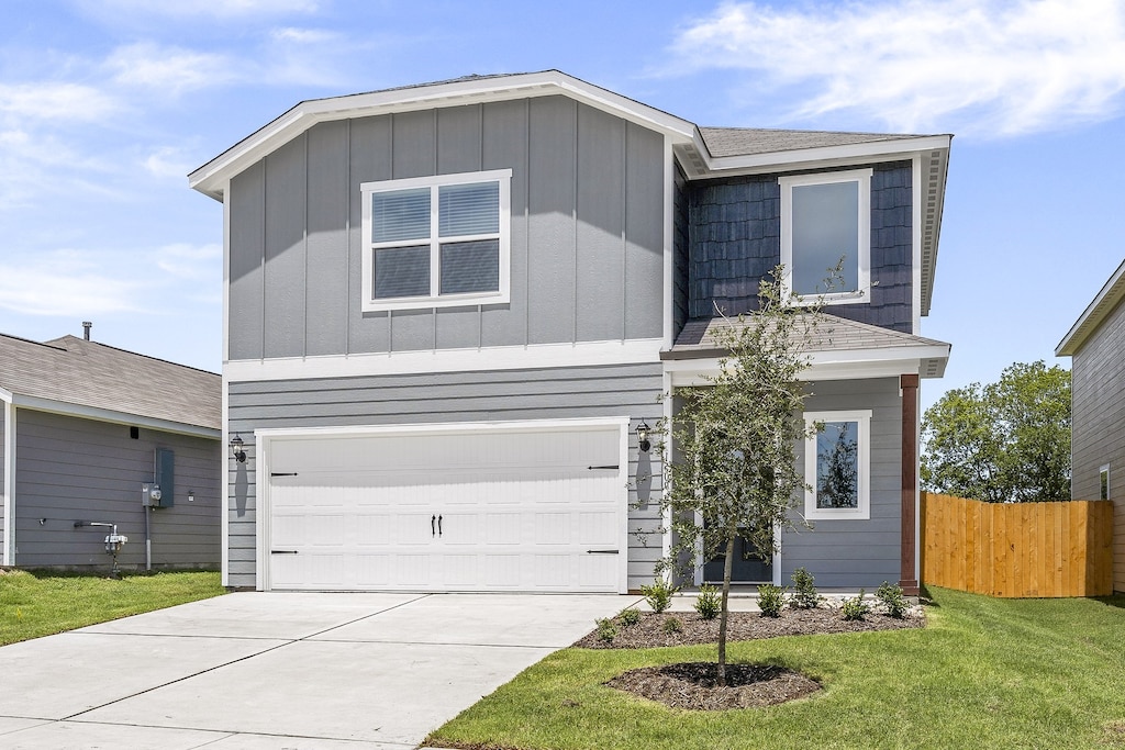 1416 Reiner Dr, Crandall, TX 75114 - view of front facade with fence, a front lawn, a garage, board and batten siding, and driveway