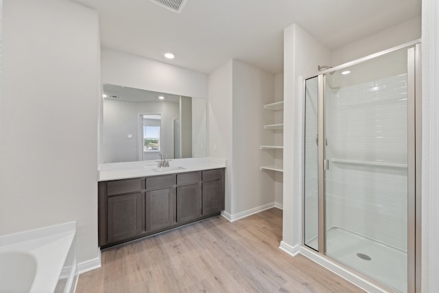 1416 Reiner Dr, Crandall, TX 75114 - bathroom featuring visible vents, a shower stall, wood finished floors, vanity, and baseboards