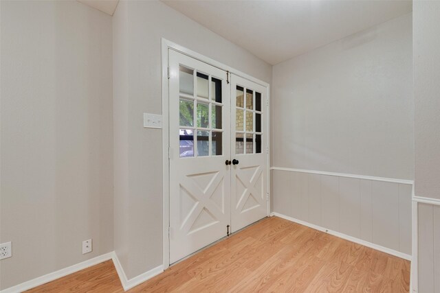 doorway with light wood finished floors