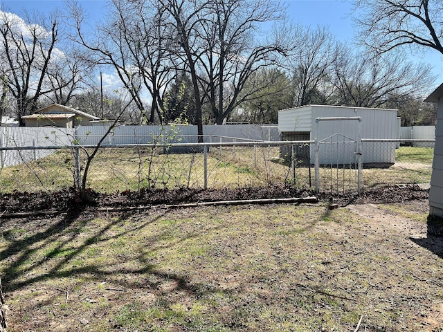 view of yard featuring an outdoor structure and fence private yard