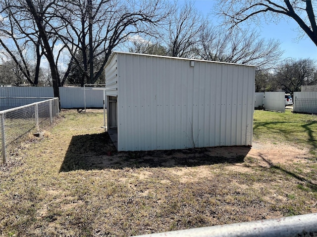 view of shed featuring fence
