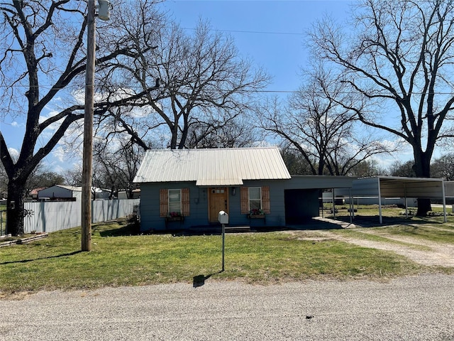 exterior space featuring fence and a carport