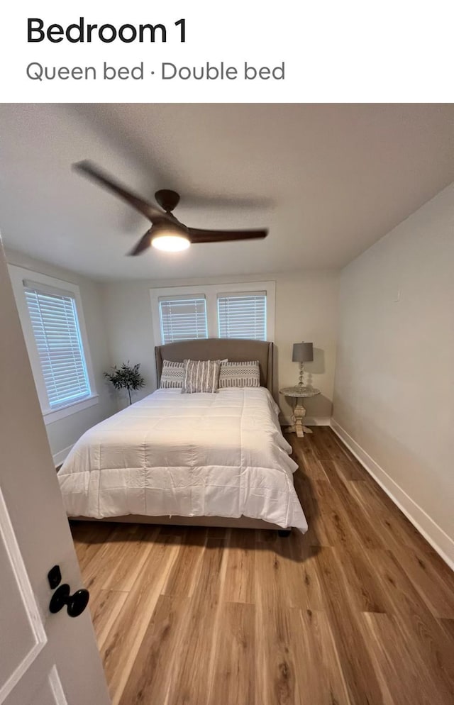 bedroom with baseboards, ceiling fan, and wood finished floors