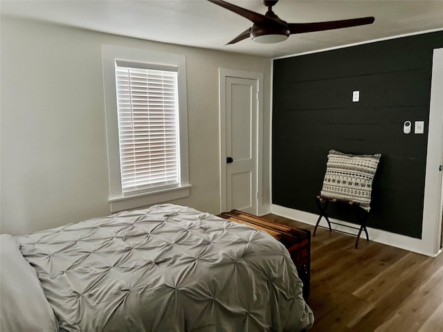 bedroom featuring ceiling fan and wood finished floors