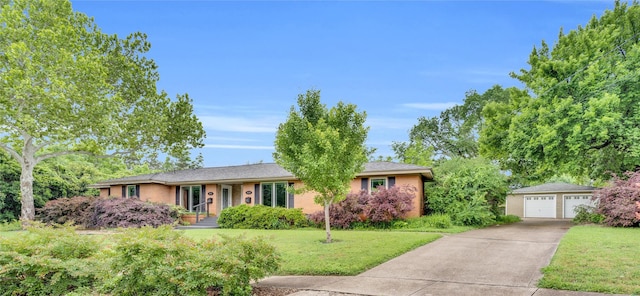 9528 Ash Creek Dr, Dallas, TX 75228 - ranch-style home featuring a detached garage, an outdoor structure, and a front lawn