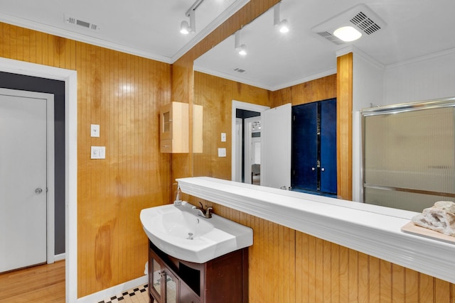 9528 Ash Creek Dr, Dallas, TX 75228 - bathroom with vanity, ornamental molding, a shower with door, and visible vents