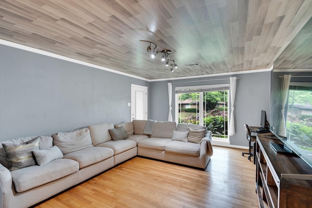 9528 Ash Creek Dr, Dallas, TX 75228 - living area featuring visible vents, ornamental molding, wood finished floors, and a wealth of natural light