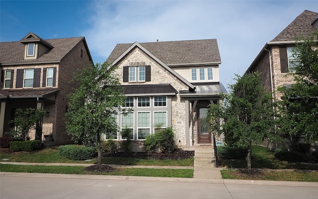 6900 Royal Liverpool Dr, Mckinney, TX 75070 - view of front of house with brick siding, a standing seam roof, a shingled roof, and metal roof